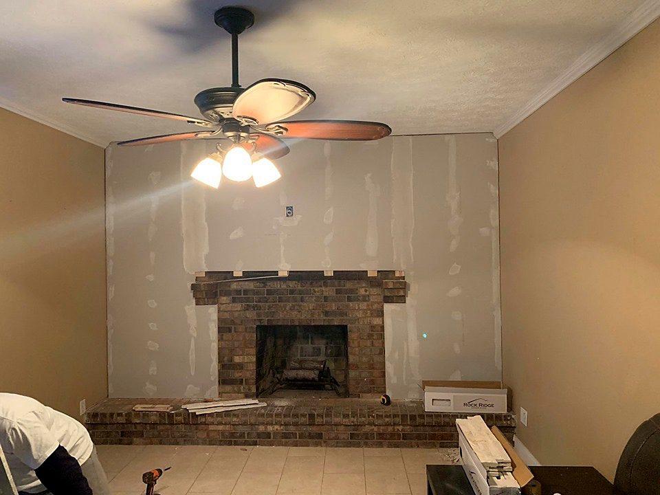 Dated brick fireplace before renovation